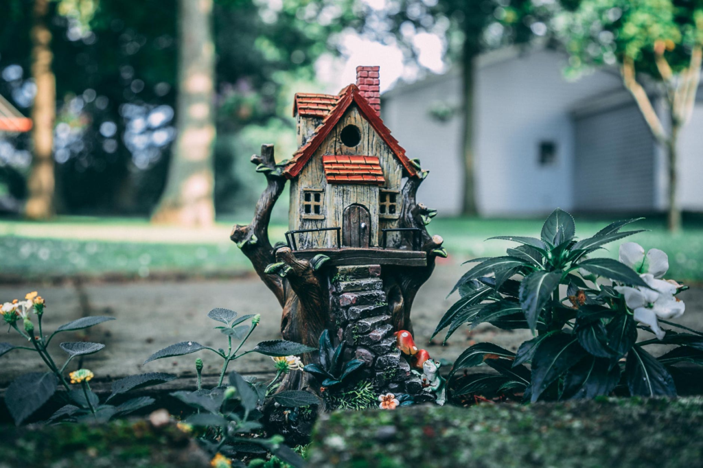 A brown and red birdhouse