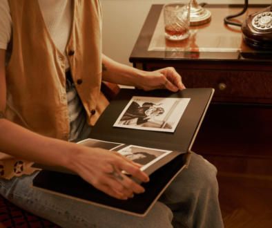 Person looking at an old photo album.