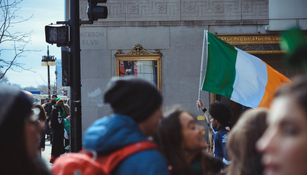 Carrying the flag of Ireland on the street.