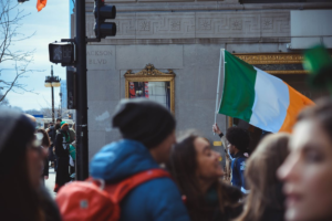 Carrying the flag of Ireland on the street.