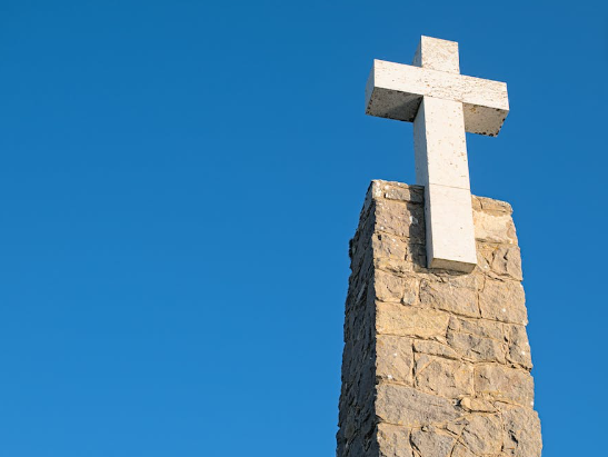White cross on church. 