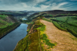 River amidst green hills