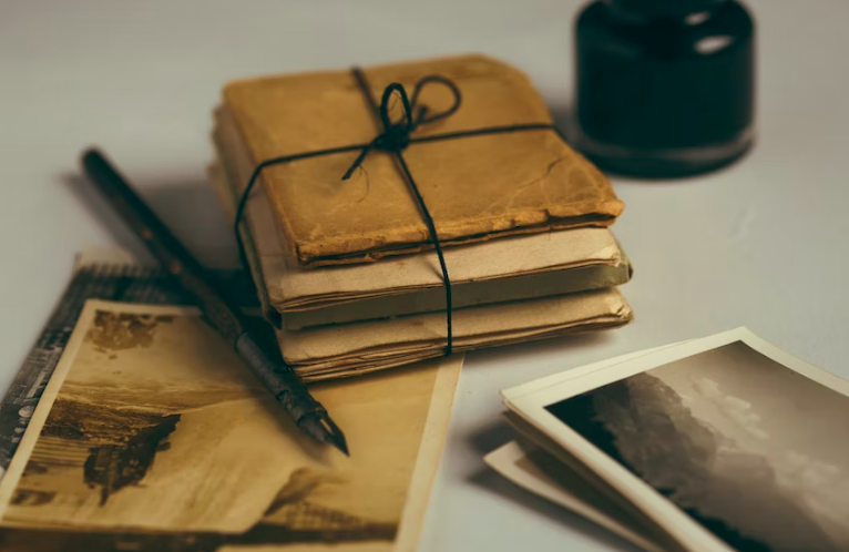 Old photographs and documents with an ink pen