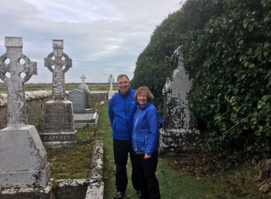 Couple visiting a graveyard in their ancestral townland