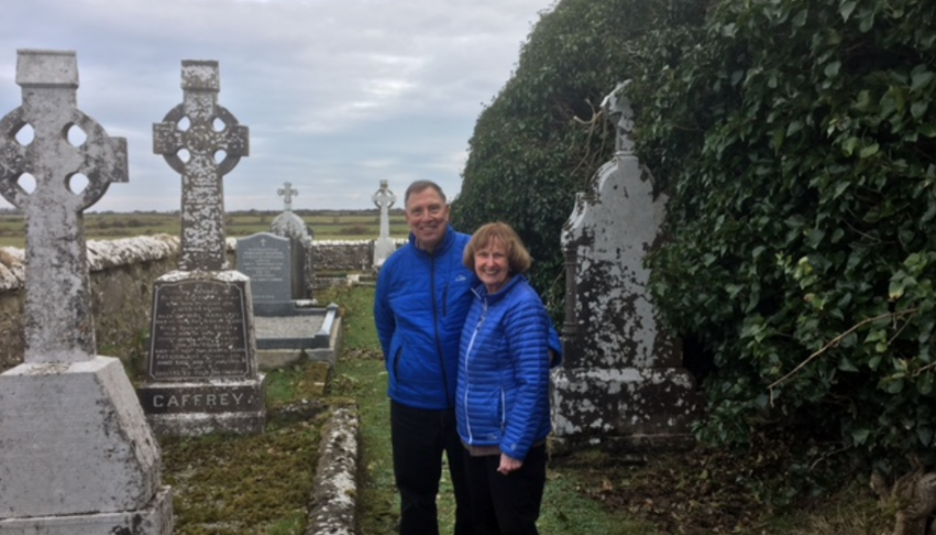 Couple visiting their Irish family graveyard