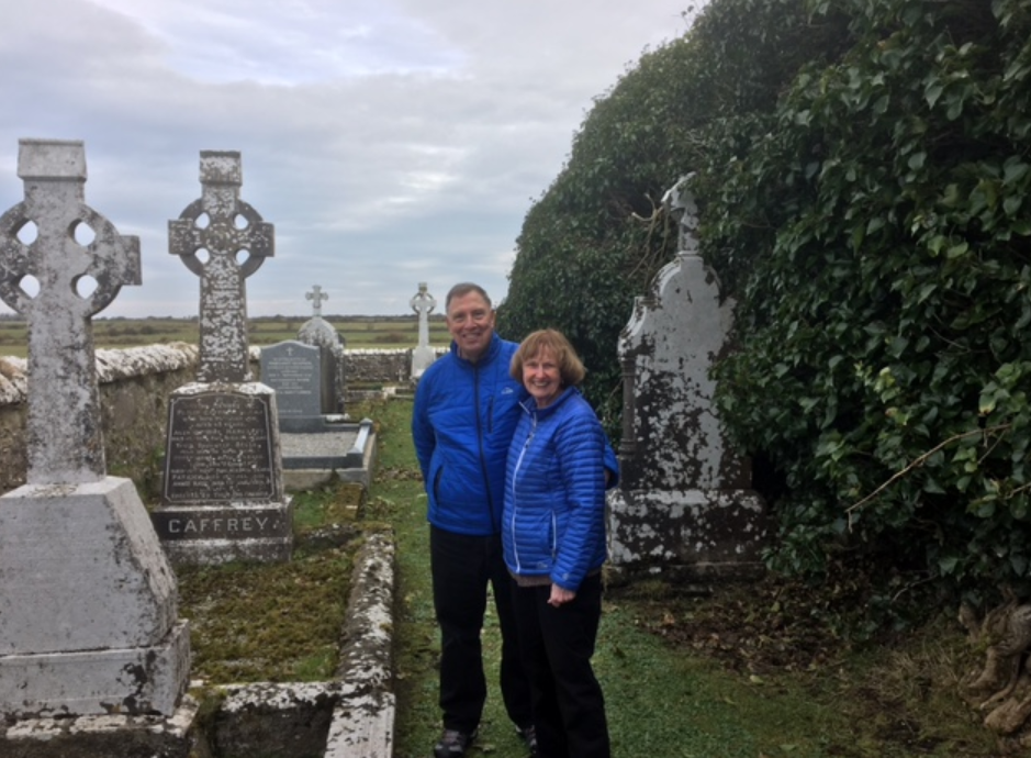 Couple visiting their Irish family graveyard