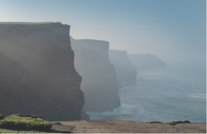 Exploring Cliffs of Moher on a historical tour of Ireland.