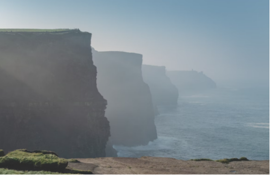 Exploring Cliffs of Moher on a historical tour of Ireland.