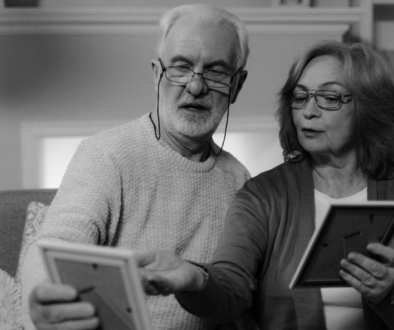 A senior couple looking at Irish family photos