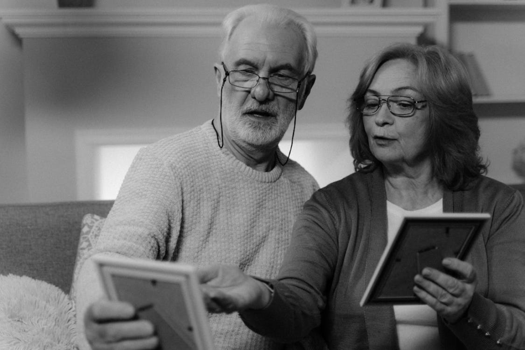 A senior couple looking at Irish family photos