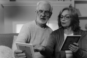 A senior couple looking at Irish family photos