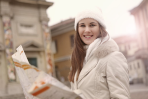 A smiling woman on a historical tour seeking her Irish family heritage