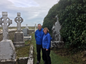 A couple visiting their ancestral graveyard.