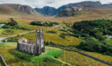 A church among sprawling green landscape in Ireland