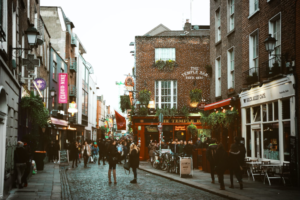 Tourists at the Temple Bar district during cultural tour of Ireland.