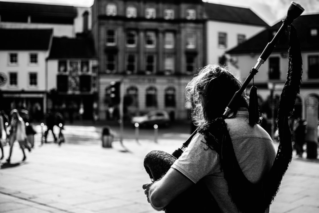 a man holding bagpipes.