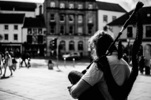 a man holding bagpipes.