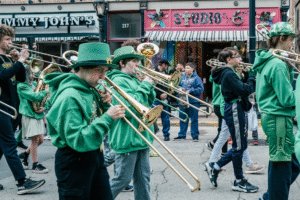 men in green playing trumpets.