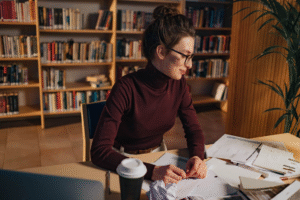 a woman sitting at the library.