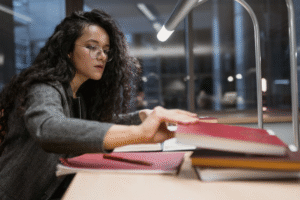 a woman studying at the library.